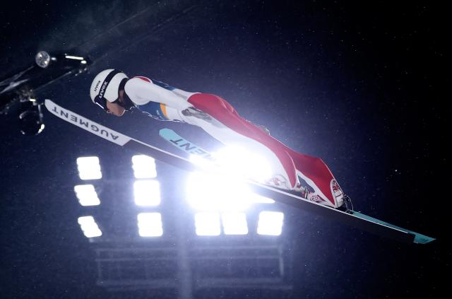 (260214) -- PREDAZZO, Feb. 14, 2026 (Xinhua) -- Song Qiwu of China competes during the 1st round of ski jumping men's large hill individual event at the Milan-Cortina 2026 Olympic Winter Games in Predazzo, Italy, Feb. 14, 2026. (Xinhua/Huang Wei)