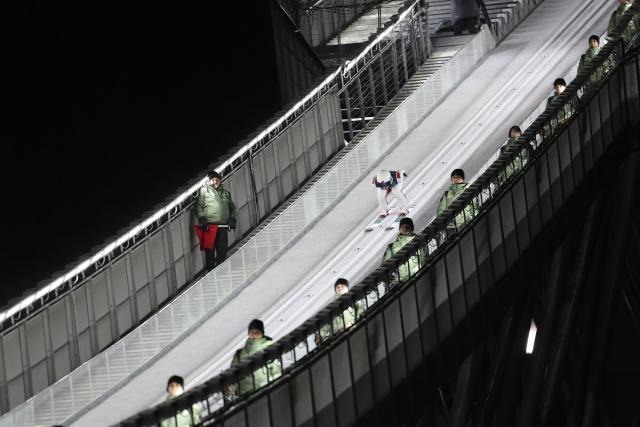 (260214) -- PREDAZZO, Feb. 14, 2026 (Xinhua) -- Song Qiwu of China competes during the 1st round of ski jumping men's large hill individual event at the Milan-Cortina 2026 Olympic Winter Games in Predazzo, Italy, Feb. 14, 2026. (Xinhua/Huang Wei)