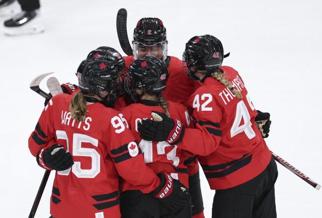 (260214) -- MILAN, Feb. 14, 2026 (Xinhua) -- Players of Canada celebrate scoring during the ice hockey women's play-offs quarterfinal between Canada and Germany at the Milan-Cortina 2026 Olympic Winter Games in Milan, Italy, Feb. 14, 2026. (Xinhua/Wang Kaiyan)