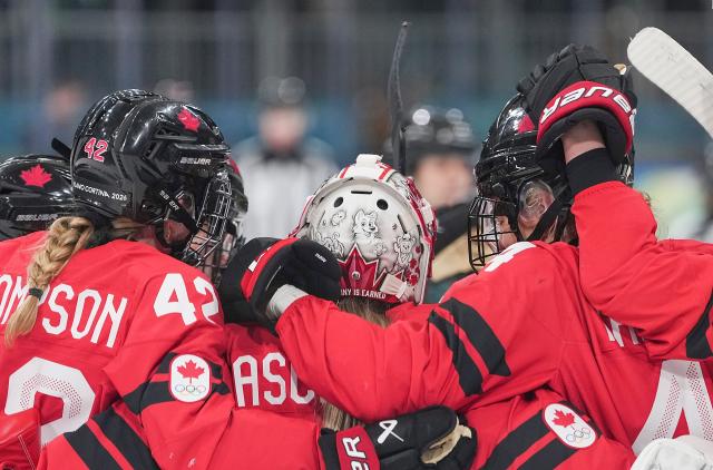 (260214) -- MILAN, Feb. 14, 2026 (Xinhua) -- Players of Canada celebrate scoring during the ice hockey women's play-offs quarterfinal between Canada and Germany at the Milan-Cortina 2026 Olympic Winter Games in Milan, Italy, Feb. 14, 2026. (Xinhua/Sun Fei)