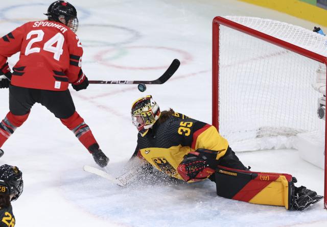 (260214) -- MILAN, Feb. 14, 2026 (Xinhua) -- Goalkeeper Sandra Abstreiter (R) of Germany defends during the ice hockey women's play-offs quarterfinal between Canada and Germany at the Milan-Cortina 2026 Olympic Winter Games in Milan, Italy, Feb. 14, 2026. (Xinhua/Wang Kaiyan)