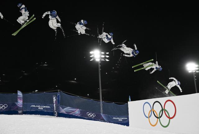 (260214) -- LIVIGNO, Feb. 14, 2026 (Xinhua) -- This multi-exposure photo shows Gu Ailing of China competing during the free skiing women's freeski big air qualification at the Milan-Cortina 2026 Olympic Winter Games in Livigno, Italy, Feb. 14, 2026. (Xinhua/Xia Yifang)