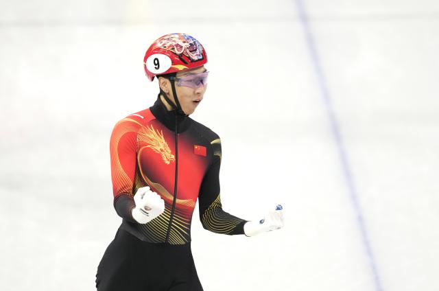 (260214) -- MILAN, Feb. 14, 2026 (Xinhua) -- Sun Long of China celebrates after the short track speed skating men's 1500m semifinal at the Milan-Cortina 2026 Olympic Winter Games in Milan, Italy, Feb. 14, 2026. (Xinhua/Xue Yuge)