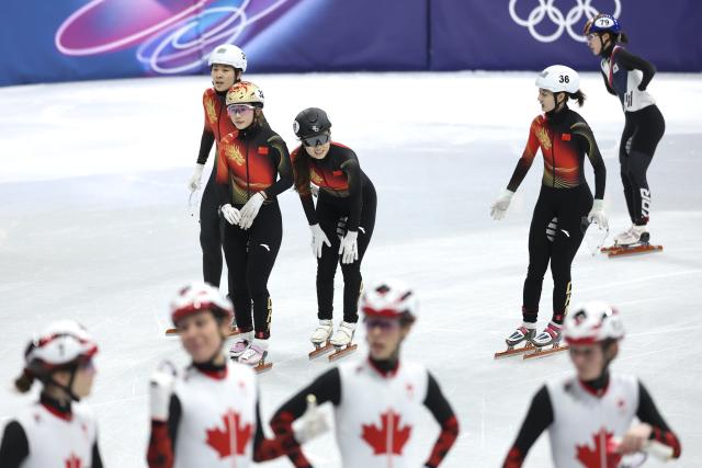 (260214) -- MILAN, Feb. 14, 2026 (Xinhua) -- Zhang Chutong, Yang Jingru, Gong Li and Wang Xinran (L to R, back) of China react after the short track speed skating women's 3000m relay semifinal at the Milan-Cortina 2026 Olympic Winter Games in Milan, Italy, Feb. 14, 2026. (Xinhua/Li Ming)