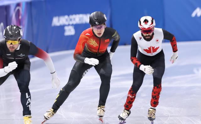(260214) -- MILAN, Feb. 14, 2026 (Xinhua) -- Liu Shaoang (C) of China competes during the short track speed skating men's 1500m final A at the Milan-Cortina 2026 Olympic Winter Games in Milan, Italy, Feb. 14, 2026. (Xinhua/Chen Yichen)