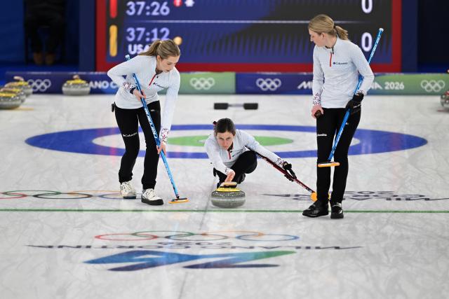 (260215) -- CORTINA D'AMPEZZO, Feb. 15, 2026 (Xinhua) -- Tabitha Peterson (C) of the United States competes during the curling women round robin session 5 match between Japan and the United States at the 2026 Milan-Cortina Winter Olympics in Cortina, Italy, Feb. 14, 2026. (Xinhua/Lian Yi)