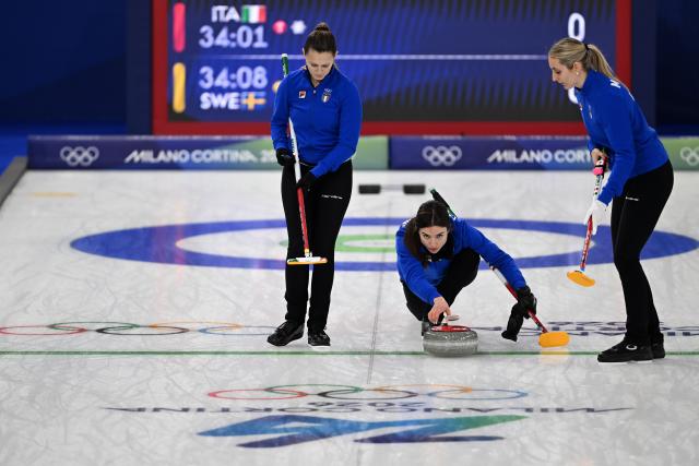 (260215) -- CORTINA D'AMPEZZO, Feb. 15, 2026 (Xinhua) -- Stefania Constantini (C) of Italy competes during the curling women round robin session 5 match between Italy and Sweden at the 2026 Milan-Cortina Winter Olympics in Cortina, Italy, Feb. 14, 2026. (Xinhua/Lian Yi)