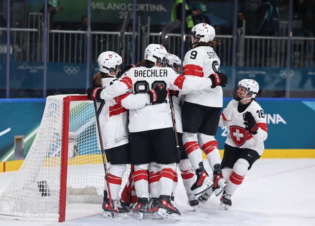 (260215) -- MILAN, Feb. 15, 2026 (Xinhua) -- Players of Switzerland celebrate after the ice hockey women's play-offs quarterfinal between Finland and Switzerland at the Milan-Cortina 2026 Olympic Winter Games in Milan, Italy, Feb. 14, 2026. (Xinhua/Wang Kaiyan)