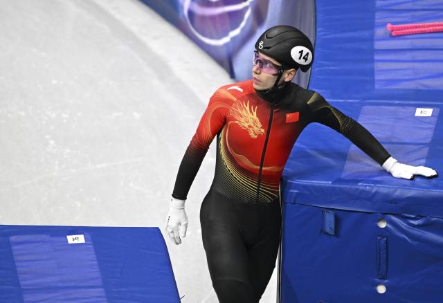 (260215) -- MILAN, Feb. 15, 2026 (Xinhua) -- Liu Shaoang (R) of China reacts after the short track speed skating men's 1500m final A at the Milan-Cortina 2026 Olympic Winter Games in Milan, Italy, Feb. 14, 2026. (Xinhua/Cheng Min)