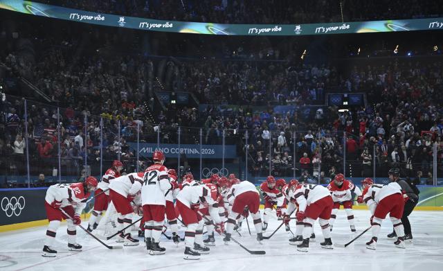 (260215) -- MILAN, Feb. 15, 2026 (Xinhua) -- Players of Denmark cheer up before the ice hockey men's preliminary round group C match between the United States and Denmark of the Milan-Cortina 2026 Olympic Winter Games in Milan, Italy, Feb. 14, 2026. (Xinhua/Zhang Haofu)