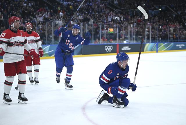 (260215) -- MILAN, Feb. 15, 2026 (Xinhua) -- Jack Eichel (1st R) of the United States celebrates during the ice hockey men's preliminary round group C match between the United States and Denmark of the Milan-Cortina 2026 Olympic Winter Games in Milan, Italy, Feb. 14, 2026. (Xinhua/Zhang Haofu)