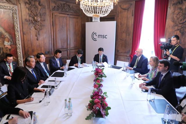 (260214) -- MUNICH, Feb. 14, 2026 (Xinhua) -- Chinese Foreign Minister Wang Yi, also a member of the Political Bureau of the Communist Party of China Central Committee, meets with Czech Deputy Prime Minister and Minister of Foreign Affairs Petr Macinka at the latter's request on the sidelines of the Munich Security Conference in Munich, Germany, Feb. 14, 2026. (Xinhua/Du Zheyu)