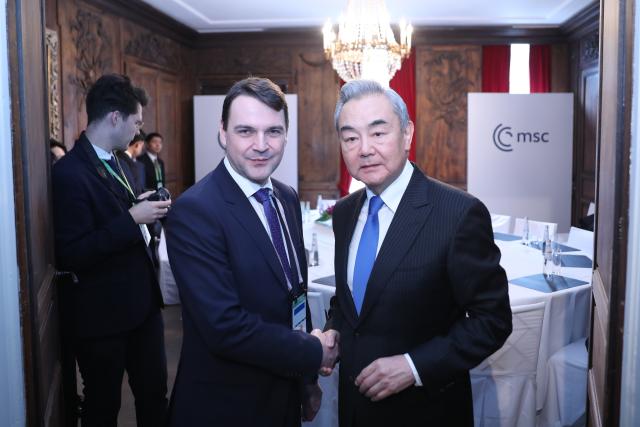 (260214) -- MUNICH, Feb. 14, 2026 (Xinhua) -- Chinese Foreign Minister Wang Yi, also a member of the Political Bureau of the Communist Party of China Central Committee, meets with Czech Deputy Prime Minister and Minister of Foreign Affairs Petr Macinka at the latter's request on the sidelines of the Munich Security Conference in Munich, Germany, Feb. 14, 2026. (Xinhua/Du Zheyu)