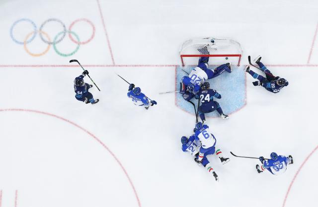 (260215) -- MILAN, Feb. 15, 2026 (Xinhua) -- Mikael Granlund (1st L) of Finland scores during the ice hockey men's preliminary round group B match between Italy and Finland of the Milan-Cortina 2026 Olympic Winter Games in Milan, Italy, Feb. 14, 2026. (Xinhua/Tao Xiyi)
