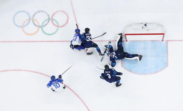 (260215) -- MILAN, Feb. 15, 2026 (Xinhua) -- Juuse Saros (1st R), goalkeeper of Finland, makes a save during the ice hockey men's preliminary round group B match between Italy and Finland of the Milan-Cortina 2026 Olympic Winter Games in Milan, Italy, Feb. 14, 2026. (Xinhua/Tao Xiyi)