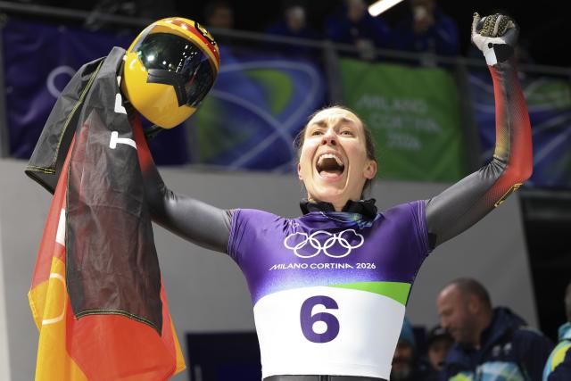 (260215) -- CORTINA D'AMPEZZO, Feb. 15, 2026 (Xinhua) -- Jacqueline Pfeifer of Germany reacts during the skeleton women's heat at the Milan-Cortina 2026 Olympic Winter Games in Cortina, Italy, Feb. 14, 2026. (Xinhua/Ding Xu)