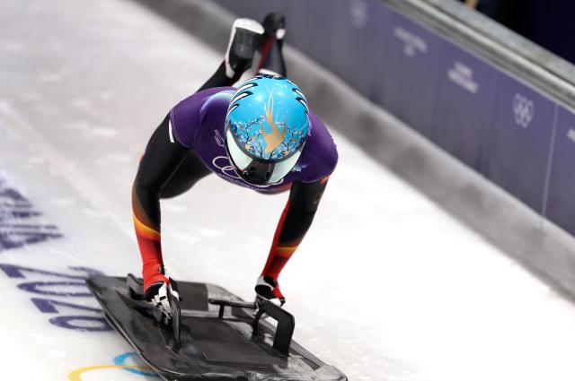 (260215) -- CORTINA D'AMPEZZO, Feb. 15, 2026 (Xinhua) -- Zhao Dan of China competes during the skeleton women's heat at the Milan-Cortina 2026 Olympic Winter Games in Cortina, Italy, Feb. 14, 2026. (Xinhua/Ding Xu)
