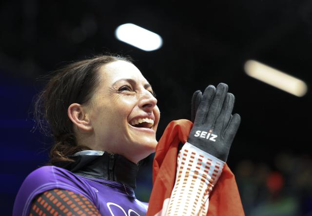 (260215) -- CORTINA D'AMPEZZO, Feb. 15, 2026 (Xinhua) -- Janine Flock of Austria reacts after the skeleton women's heat at the Milan-Cortina 2026 Olympic Winter Games in Cortina, Italy, Feb. 14, 2026. (Xinhua/Ding Xu)