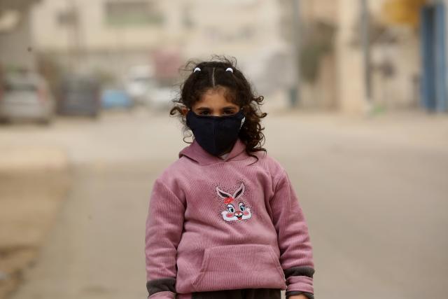 (260215) -- NABLUS, Feb. 15, 2026 (Xinhua) -- A Palestinian girl is seen on a street during a dust storm in the West Bank city of Nablus on Feb. 14, 2026. (Photo by Nidal Eshtayeh/Xinhua)