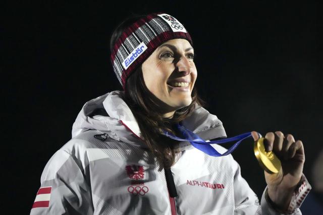 (260215) -- CORTINA D'AMPEZZO, Feb. 15, 2026 (Xinhua) -- Gold medalist Janine Flock of Austria poses during the awarding ceremony for the skeleton women's competition at the Milan-Cortina 2026 Olympic Winter Games in Cortina, Italy, Feb. 14, 2026. (Xinhua/Li Gang)
