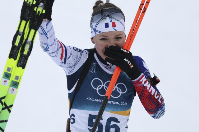 (260215) -- ANTERSELVA, Feb. 15, 2026 (Xinhua) -- Silver medalist Oceane Michelon of France celebrates after crossing the finish line during the biathlon women's 7.5km sprint event at the Milan-Cortina 2026 Olympic Winter Games in Anterselva, Italy, Feb. 14, 2026. (Xinhua/Zhang Tao)