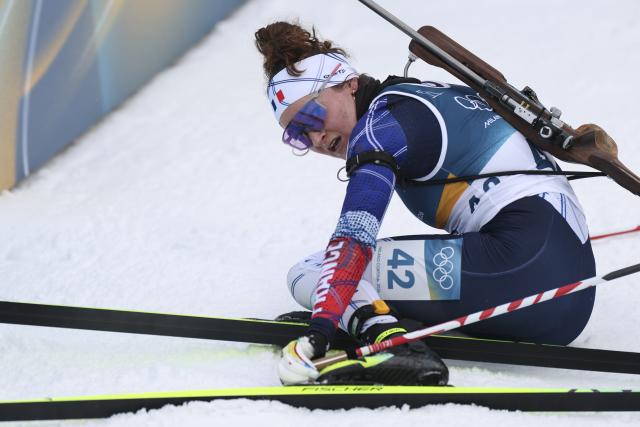 (260215) -- ANTERSELVA, Feb. 15, 2026 (Xinhua) -- Bronze medalist Lou Jeanmonnot of France watches her result after crossing the finish line during the biathlon women's 7.5km sprint event at the Milan-Cortina 2026 Olympic Winter Games in Anterselva, Italy, Feb. 14, 2026. (Xinhua/Zhang Tao)