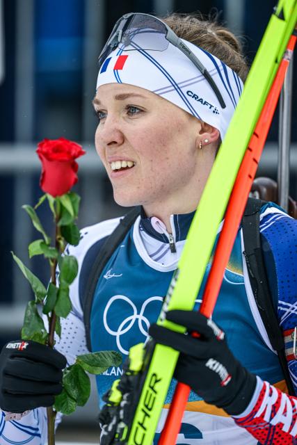 (260215) -- ANTERSELVA, Feb. 15, 2026 (Xinhua) -- Oceane Michelon of France holds a rose after the biathlon women's 7.5km sprint event at the Milan-Cortina 2026 Olympic Winter Games in Anterselva, Italy, Feb. 14, 2026. (Xinhua/Jiang Han)