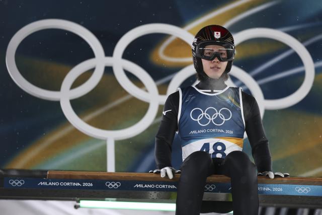 (260215) -- PREDAZZO, Feb. 15, 2026 (Xinhua) -- Nikaido Ren of Japan prepares to jump during the trial round of ski jumping men's large hill individual event at the Milan-Cortina 2026 Olympic Winter Games in Predazzo, Italy, Feb. 14, 2026. (Xinhua/Huang Wei)
