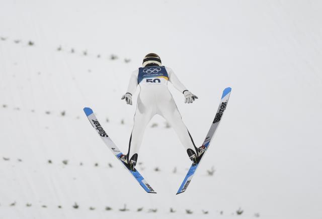 (260215) -- PREDAZZO, Feb. 15, 2026 (Xinhua) -- Domen Prevc of Slovenia competes during the 1st round of ski jumping men's large hill individual event at the Milan-Cortina 2026 Olympic Winter Games in Predazzo, Italy, Feb. 14, 2026. (Xinhua/Huang Wei)