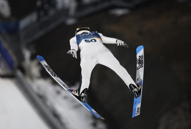 (260215) -- PREDAZZO, Feb. 15, 2026 (Xinhua) -- Domen Prevc of Slovenia competes during the 1st round of ski jumping men's large hill individual event at the Milan-Cortina 2026 Olympic Winter Games in Predazzo, Italy, Feb. 14, 2026. (Xinhua/Huang Wei)
