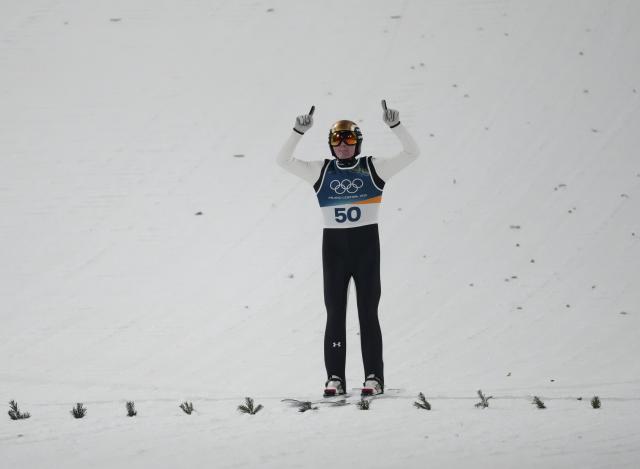 (260215) -- PREDAZZO, Feb. 15, 2026 (Xinhua) -- Domen Prevc of Slovenia reacts after finishing the final round jump of ski jumping men's large hill individual event at the Milan-Cortina 2026 Olympic Winter Games in Predazzo, Italy, Feb. 14, 2026. (Xinhua/Huang Wei)