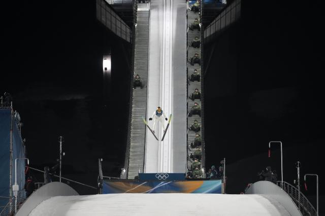 (260215) -- PREDAZZO, Feb. 15, 2026 (Xinhua) -- Kacper Tomasiak of Poland competes during the final round of ski jumping men's large hill individual event at the Milan-Cortina 2026 Olympic Winter Games in Predazzo, Italy, Feb. 14, 2026. (Xinhua/Huang Wei)