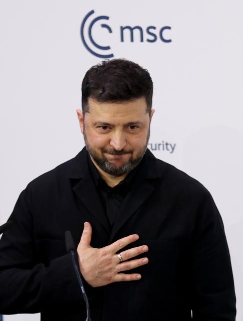 (260215) -- MUNICH, Feb. 15, 2026 (Xinhua) -- Ukrainian President Volodymyr Zelensky greets the audience after his speech during the 62nd Munich Security Conference (MSC) in Munich, Germany, Feb. 14, 2026. Ukrainian President Volodymyr Zelensky said Saturday in Munich, Germany that Ukraine is ready for an agreement that will bring real peace, the Ukrinform news agency reported. (Xinhua/Li Ying)