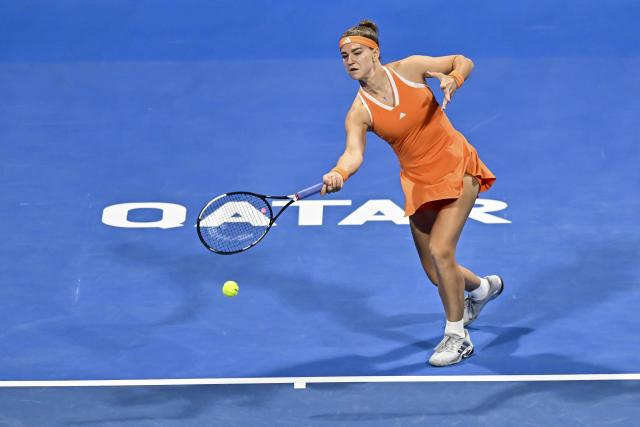 (260215) -- DOHA, Feb. 15, 2026 (Xinhua) -- Karolina Muchova of the Czech Republic hits a return during the women's singles final match between Karolina Muchova of the Czech Republic and Victoria Mboko of Canada at the WTA Qatar Open 2026 tennis tournament in Doha, Qatar, on Feb. 14, 2026. (Photo by Nikku/Xinhua)