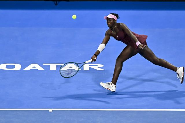 (260215) -- DOHA, Feb. 15, 2026 (Xinhua) -- Victoria Mboko of Canada hits a return during the women's singles final match between Karolina Muchova of the Czech Republic and Victoria Mboko of Canada at the WTA Qatar Open 2026 tennis tournament in Doha, Qatar, on Feb. 14, 2026. (Photo by Nikku/Xinhua)