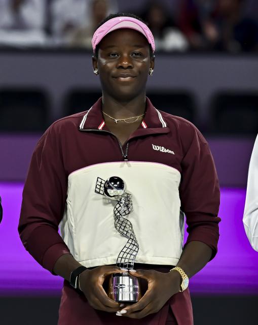 (260215) -- DOHA, Feb. 15, 2026 (Xinhua) -- Victoria Mboko of Canada poses with the runner-up trophy during the awarding ceremony for the women's singles match of the WTA Qatar Open 2026 tennis tournament in Doha, Qatar, on Feb. 14, 2026. (Photo by Nikku/Xinhua)