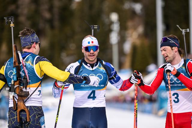 (260215) -- ANTERSELVA, Feb. 15, 2026 (Xinhua) -- Gold medalist Martin Ponsiluoma of Sweden, bronze medalist Emilien Jacquelin of France and silver medalist Sturla Holm Laegreid of Norway (L to R) greet each other after the biathlon Men's 12.5km Pursuit at the 2026 Milan-Cortina Winter Olympics in Anterselva, Italy, Feb. 15, 2026. (Xinhua/Jiang Han)