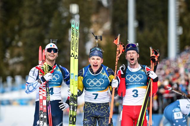 (260215) -- ANTERSELVA, Feb. 15, 2026 (Xinhua) -- Bronze medalist Emilien Jacquelin of France, gold medalist Martin Ponsiluoma of Sweden and silver medalist Sturla Holm Laegreid of Norway (L to R) pose after the biathlon Men's 12.5km Pursuit at the 2026 Milan-Cortina Winter Olympics in Anterselva, Italy, Feb. 15, 2026. (Xinhua/Jiang Han)