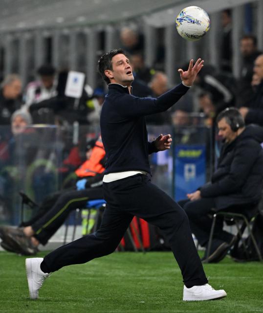 (260215) -- MILAN, Feb. 15, 2026 (Xinhua) -- Inter Milan's head coach Cristian Chivu reacts during a Serie A football match between Inter Milan and Juventus in Milan, Italy, Feb. 14, 2026. (Photo by Alberto Lingria/Xinhua)