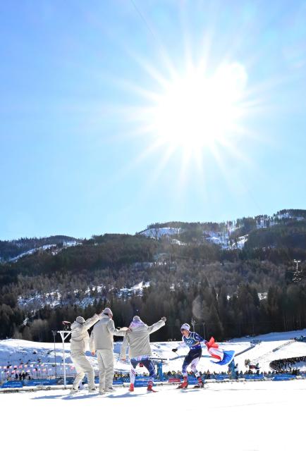 (260215) -- TESERO, Feb. 15, 2026 (Xinhua) -- Members of Team France celebrate after competing at the cross-country skiing men's 4X7.5km relay match at the Milan-Cortina 2026 Olympic Winter Games in Tesero, Italy, Feb. 15, 2026. (Xinhua/He Canling)