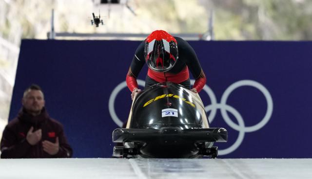 (260215) -- CORTINA D'AMPEZZO, Feb. 15, 2026 (Xinhua) -- Huai Mingming of China competes during the bobsleigh women's monobob heat at the 2026 Milan-Cortina Winter Olympics in Cortina, Italy, Feb. 15, 2026. (Xinhua/Li Gang)