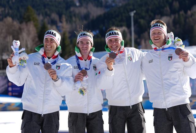 (260215) -- TESERO, Feb. 15, 2026 (Xinhua) -- Bronze medalists team Italy pose during the awarding ceremony for the cross-country skiing men's 4X7.5km relay match at the Milan-Cortina 2026 Olympic Winter Games in Tesero, Italy, Feb. 15, 2026. (Xinhua/Peng Ziyang)