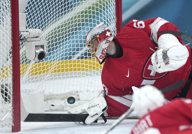 (260215) -- MILAN, Feb. 15, 2026 (Xinhua) -- Leonardo Genoni, goalkeeper of Switzerland, fails to make a save during the ice hockey men's preliminary round group A match between Switzerland and the Czech Republic of the Milan-Cortina 2026 Olympic Winter Games in Milan, Italy, Feb. 15, 2026. (Xinhua/Tao Xiyi)