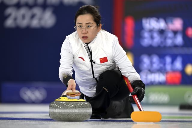 (260215) -- CORTINA D'AMPEZZO, Feb. 15, 2026 (Xinhua) -- Wang Rui of China competes during the curling women round robin session 6 match between China and the United States at the 2026 Milan-Cortina Winter Olympics in Cortina, Italy, Feb. 15, 2026. (Xinhua/Lian Yi)