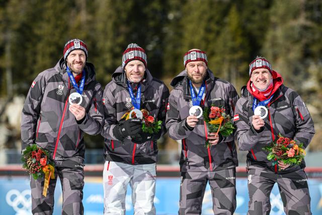 (260215) -- ANTERSELVA, Feb. 15, 2026 (Xinhua) -- Christoph Sumann, Daniel Mesotitsch, Simon Eder and Dominik Landertinger of Austria, silver medalists for the men's 4x7.5-kilometer biathlon relay race from the 2014 Sochi Winter Olympics, pose for photos with the medals during a reallocation medals ceremony at the 2026 Winter Olympics in Anterselva, Italy, Feb. 15, 2026. (Xinhua/Jiang Han)