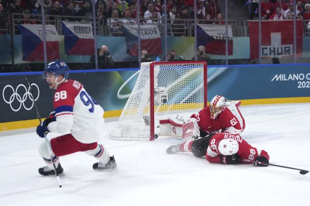 (260215) -- MILAN, Feb. 15, 2026 (Xinhua) -- Leonardo Genoni (back), goalkeeper of Switzerland, fails to make a save during the ice hockey men's preliminary round group A match between Switzerland and the Czech Republic of the Milan-Cortina 2026 Olympic Winter Games in Milan, Italy, Feb. 15, 2026. (Xinhua/Tao Xiyi)