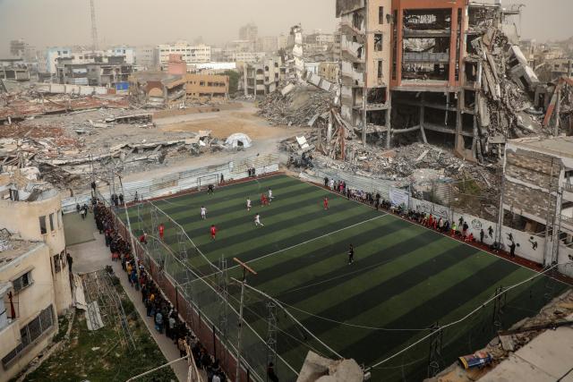 (260215) -- GAZA, Feb. 15, 2026 (Xinhua) -- Palestinians participate in a football game in south Gaza City on Feb. 14, 2026. (Photo by Rizek Abdeljawad/Xinhua)