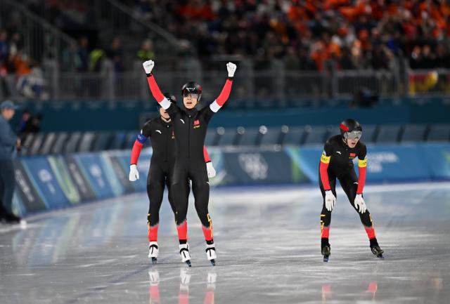 (260215) -- MILAN, Feb. 15, 2026 (Xinhua) -- Li Wenhao, Liu Hanbin and Wu Yu (L to R) of China celebrate after the speed skating men's team pursuit quarterfinal at the Milan-Cortina 2026 Olympic Winter Games in Milan, Italy, Feb. 15, 2026. (Xinhua/Wu Wei)