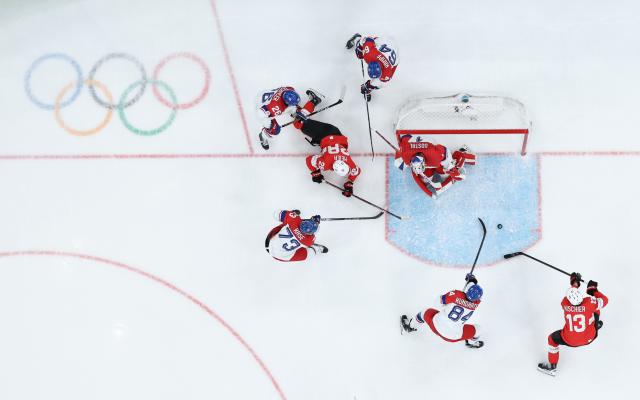 (260215) -- MILAN, Feb. 15, 2026 (Xinhua) -- Nico Hischier (1st R) of Switzerland competes during the ice hockey men's preliminary round group A match between Switzerland and the Czech Republic of the Milan-Cortina 2026 Olympic Winter Games in Milan, Italy, Feb. 15, 2026. (Xinhua/Tao Xiyi)