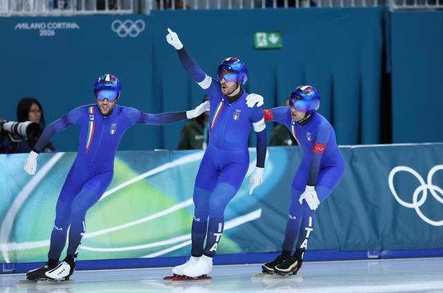 (260215) -- MILAN, Feb. 15, 2026 (Xinhua) -- Athletes of Italy celebrate after the speed skating men's team pursuit quarterfinal at the Milan-Cortina 2026 Olympic Winter Games in Milan, Italy, Feb. 15, 2026. (Xinhua/Li Jing)